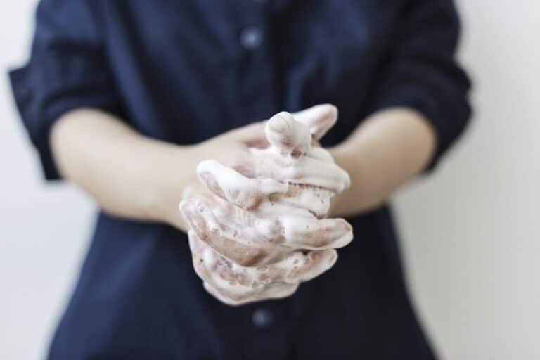 woman washing their hands