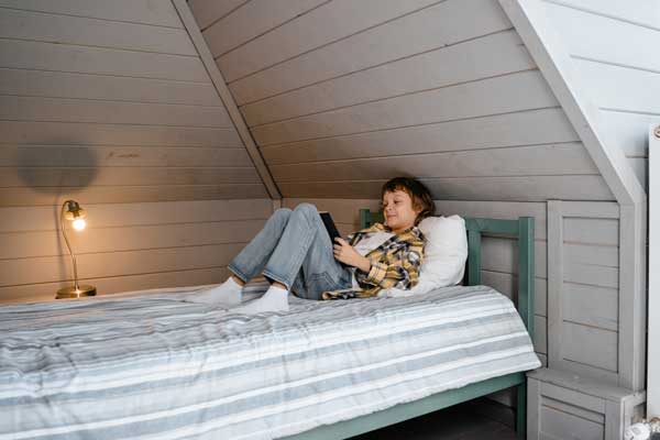 foster child reading on bed