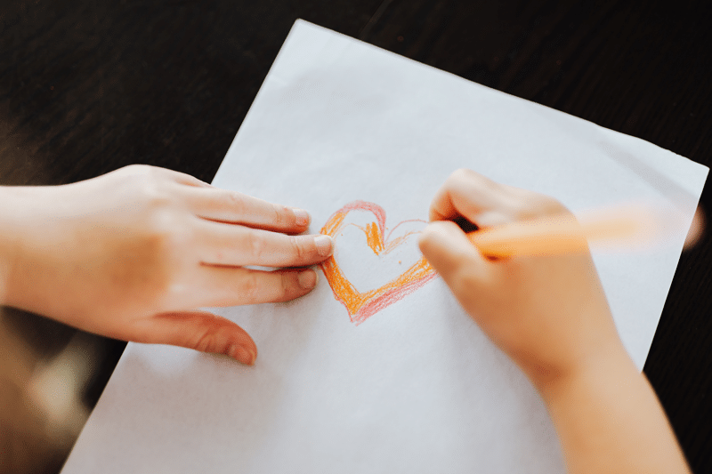 child drawing heart fasd